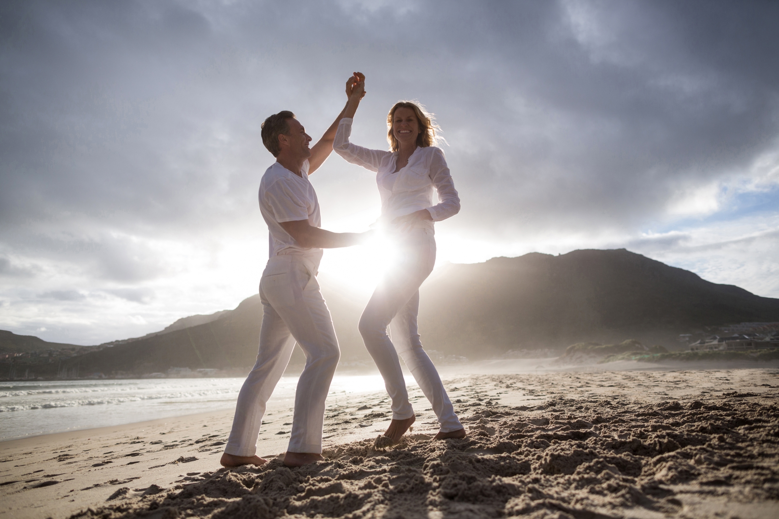 Mature couple having fun together at beach