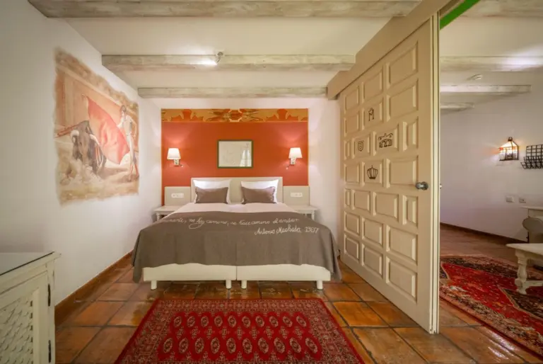A hotel room with a double bed