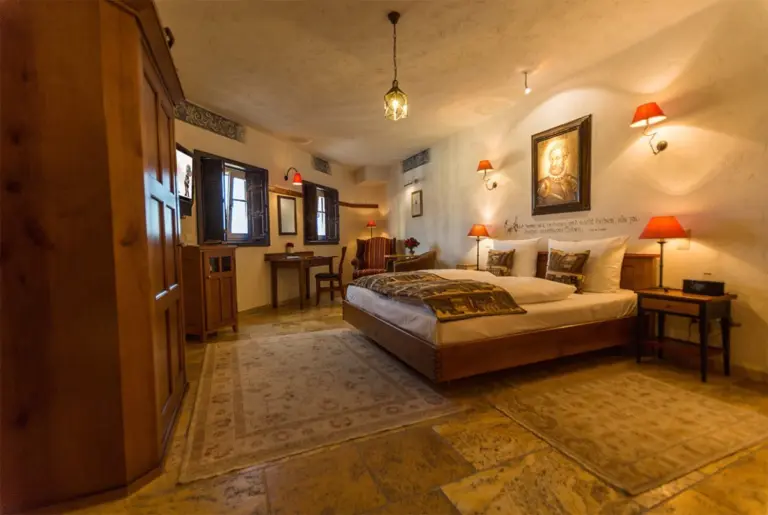A hotel room with a double bed