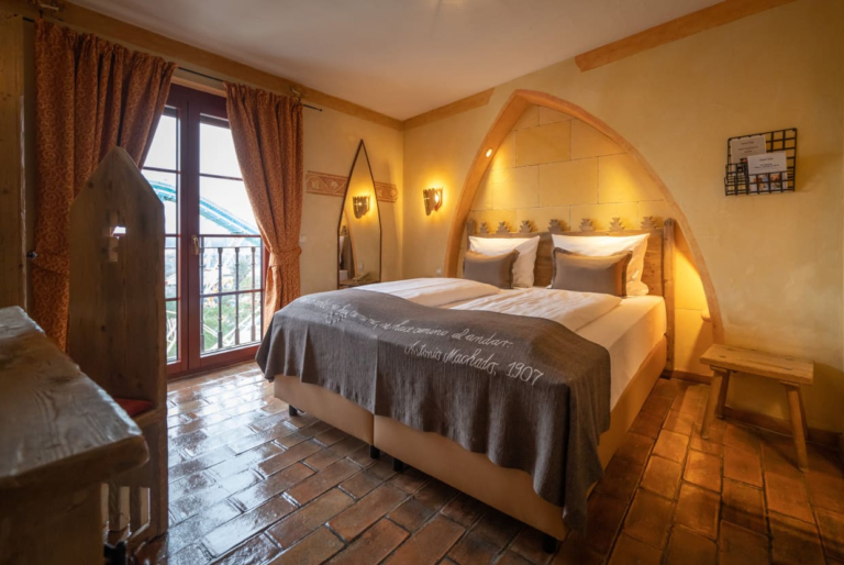 A hotel room with a double bed