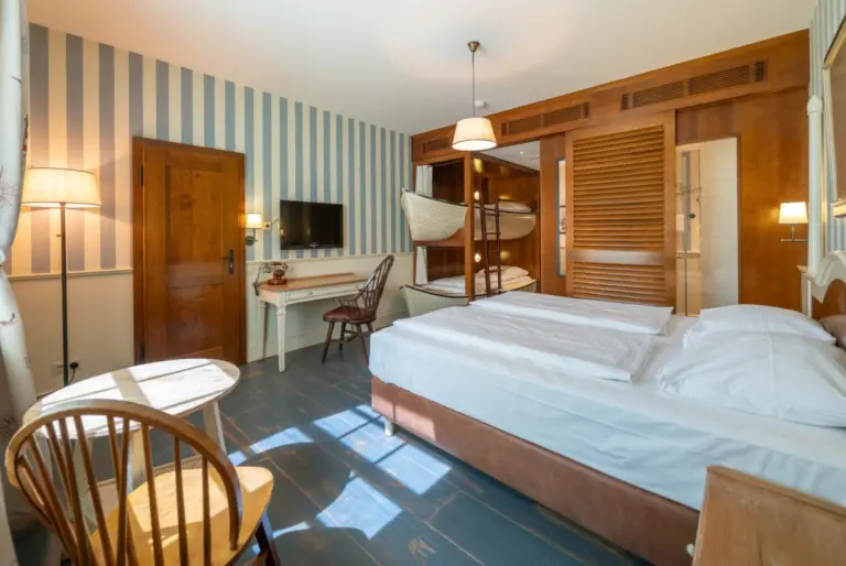 A photo of a hotel room decorated in a nautical style